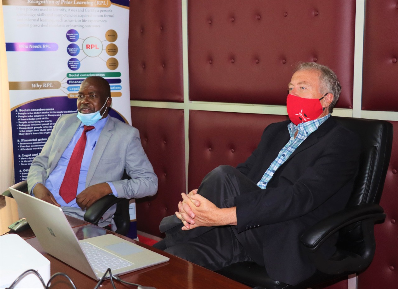 Deputy Director Planning,  Research, Outreach & Policy- Stanley Maindi during a courtesy call by the Senior Technical Advisor – Young Africa Works- Kenya Mr. Ian Warrender at the KNQA offices. The meeting discussed the progress made in the implementation of RPL in Kenya.