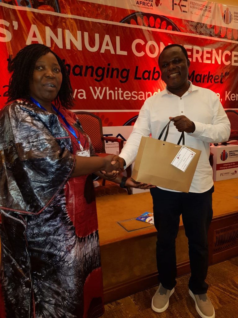 Dr Juma Mukhwana DG KNQA receiving a gift from Dr Jackyline Mugo CEO of FKE at the beginning of the Annual employers Conference.  Dr Mukhwana said that the KNQF is a tool for continuing Reform and Transforming Education to ensure skills keep pace with labour market needs.